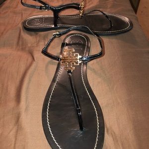 Tory Burch Shoes - Tory Burch Black Sandals with gold emblem! Size 10 Tory Burch Shoes - Tory Burch Black Sandals with gold emblem! Size 10